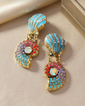 Multicolored earrings on a beige surface with a discount banner at the bottom.