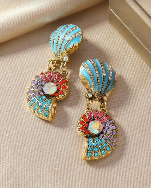 Multicolored earrings on a beige surface with a discount banner at the bottom.